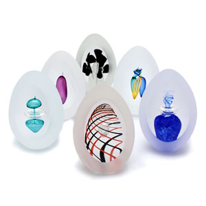 Unique Bohemia Glass pieces. Choose from an offer of several sets of coloured hand-cut glass paperweights in egg shape.